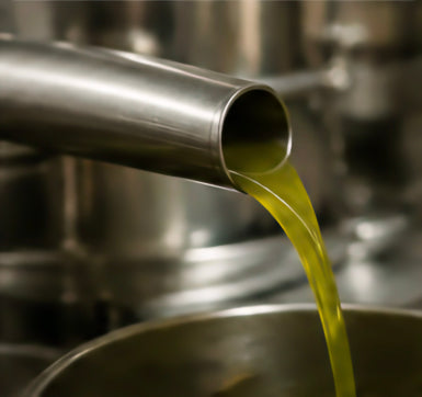 Fresh olive oil during first cold press extraction
